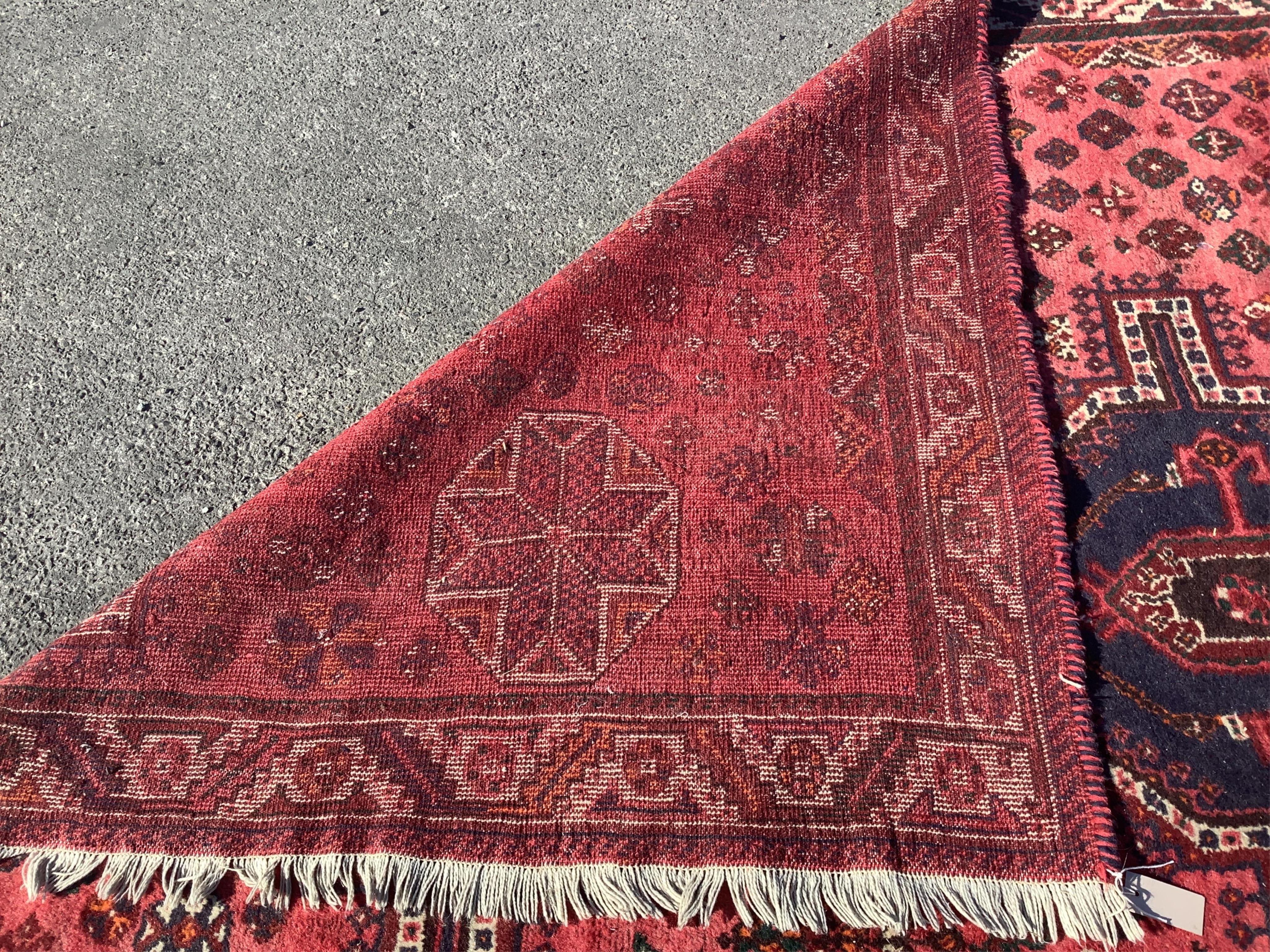 A Hamadan red ground carpet, 270 x 214cm. Condition - fair